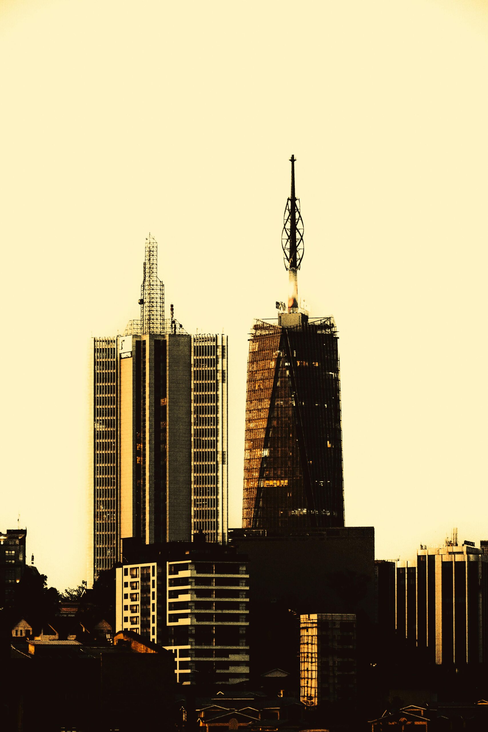 Capture of Nairobi's iconic skyline featuring modern skyscrapers at dusk, symbolizing urban progress.